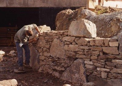 Clayton Babcock building the German Barn stone wall, 2001, Photograph by Constance Kheel