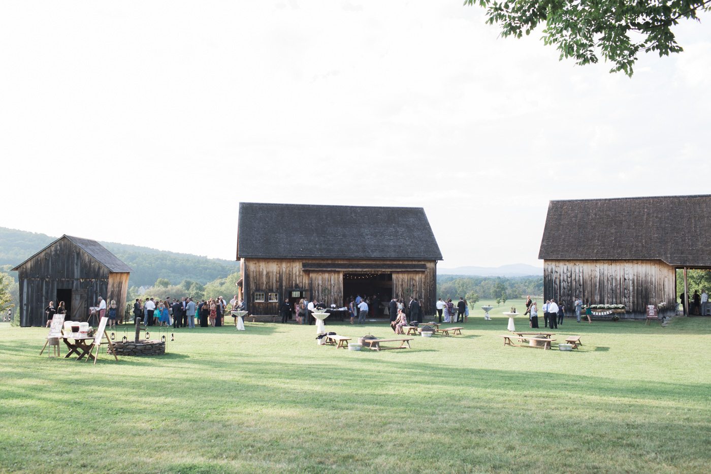 Outdoor wedding reception at historic barn setting in upstate New York