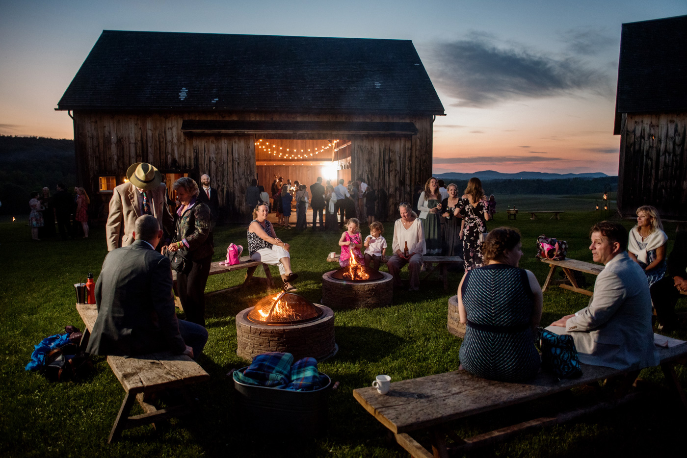 Guests enjoy campfires at a Nipmoose wedding in upstate New York, Heather Bohm-Tallman Photography